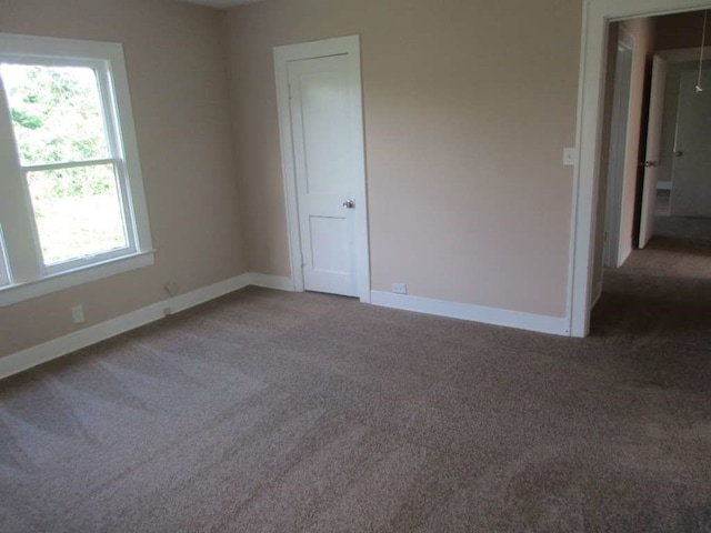 unfurnished room featuring carpet