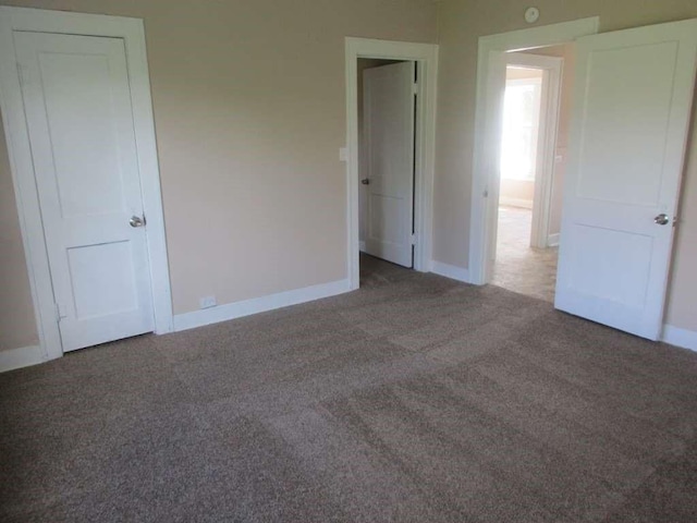 110 Spencer St, Brazoria, TX 77422 - unfurnished bedroom featuring baseboards and carpet