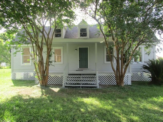 exterior space featuring a front lawn and a porch