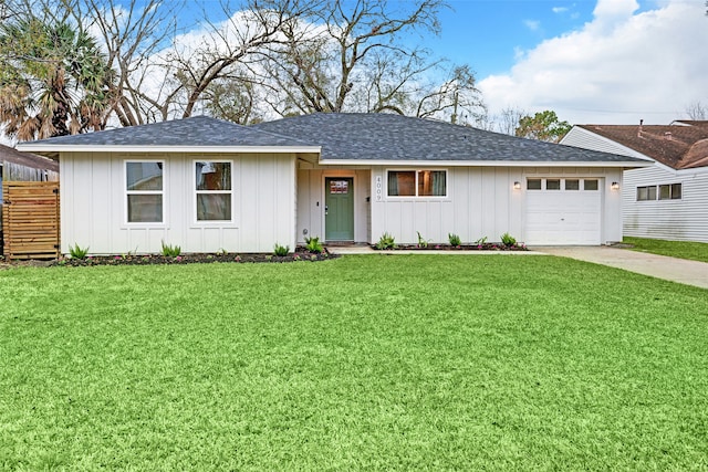 ranch-style home featuring a garage and a front lawn