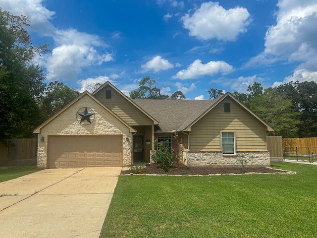 view of front of property with a front yard and a garage