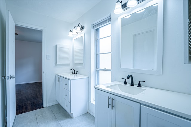 bathroom featuring tile patterned flooring and vanity