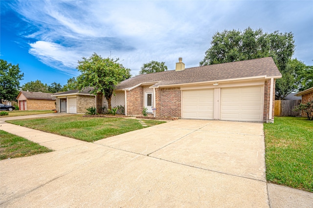 ranch-style house with a garage and a front yard