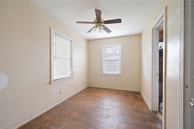 unfurnished bedroom with ceiling fan and dark hardwood / wood-style floors