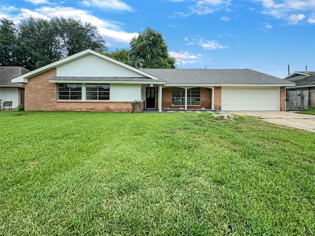 ranch-style house featuring a front yard and a garage