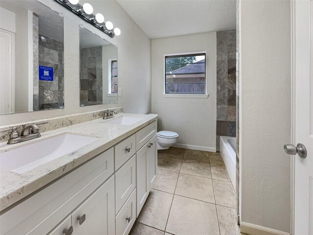 full bathroom with a textured ceiling, vanity, separate shower and tub, tile patterned flooring, and toilet