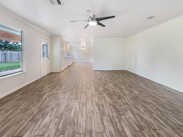 interior space featuring crown molding, ceiling fan, and hardwood / wood-style floors