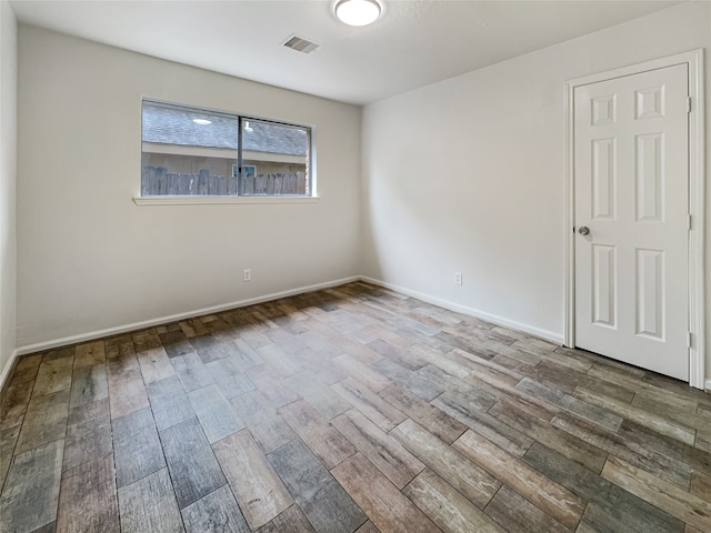 spare room featuring hardwood / wood-style flooring