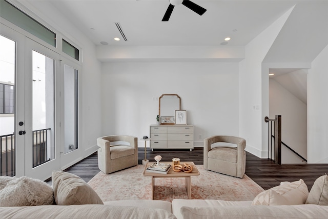 living room with ceiling fan, dark hardwood / wood-style floors, and french doors