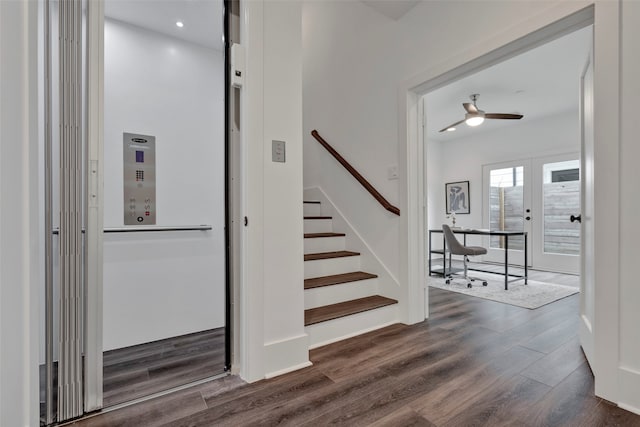 staircase with french doors, wood-type flooring, and ceiling fan