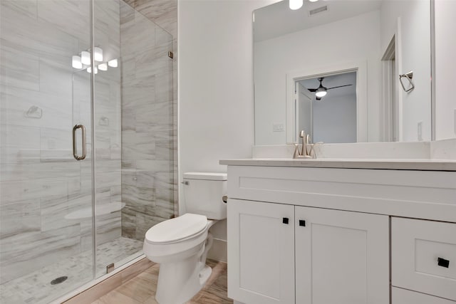 bathroom with vanity, toilet, and walk in shower