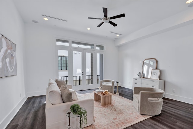 living room with french doors, ceiling fan, and dark hardwood / wood-style floors