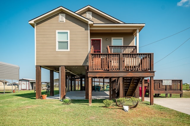 exterior space with a front lawn, a carport, and a deck