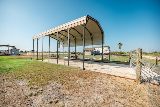 exterior space featuring a lawn and a carport