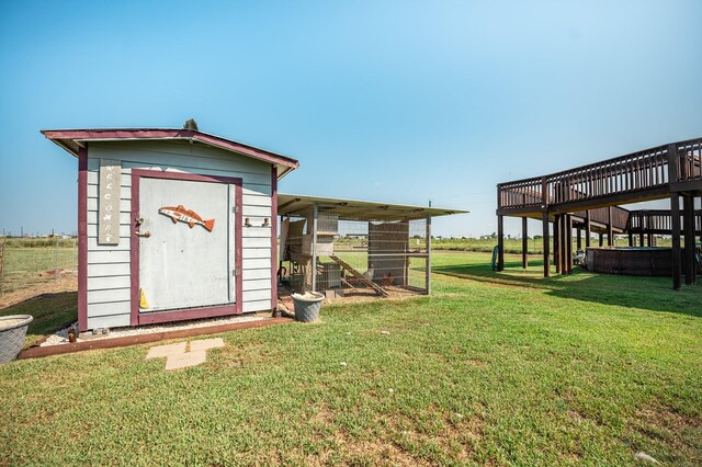 view of outbuilding with a lawn