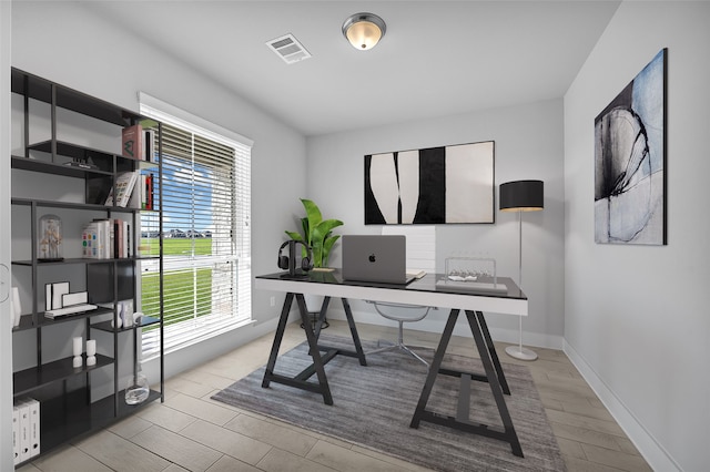 office space with light wood-type flooring