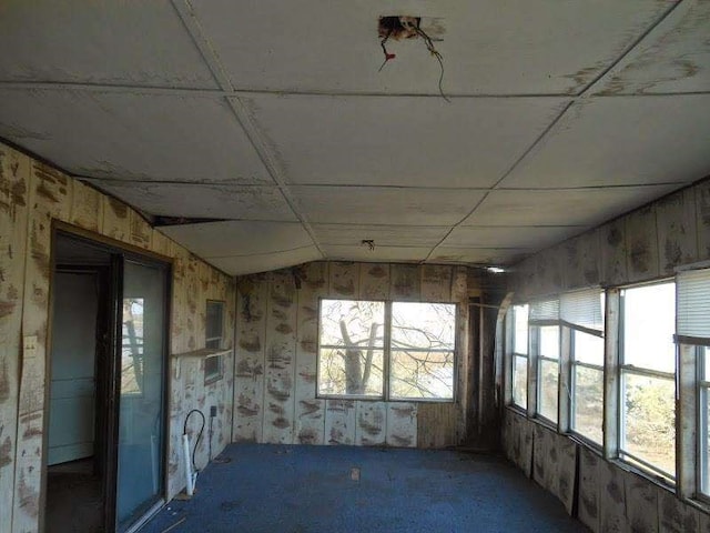 unfurnished sunroom with a paneled ceiling