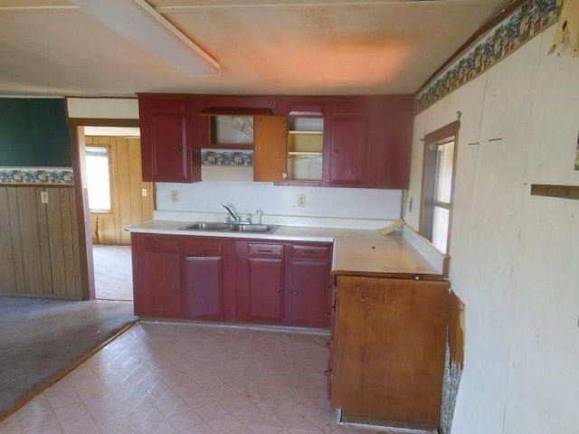 kitchen with wood walls and sink