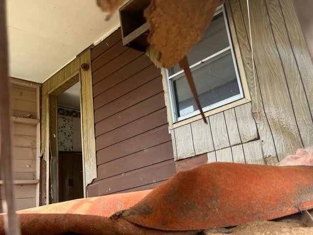 exterior space featuring wooden walls