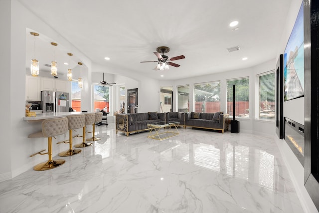 living room featuring ceiling fan