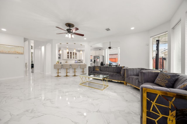 living room with ceiling fan