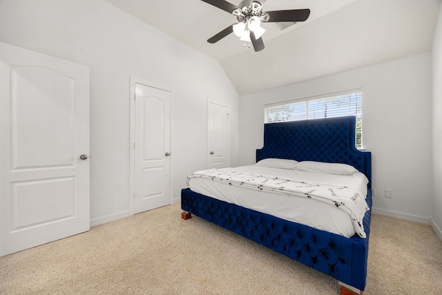 carpeted bedroom featuring vaulted ceiling and ceiling fan