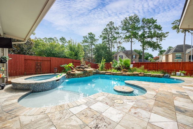 view of swimming pool featuring a patio, an in ground hot tub, and pool water feature