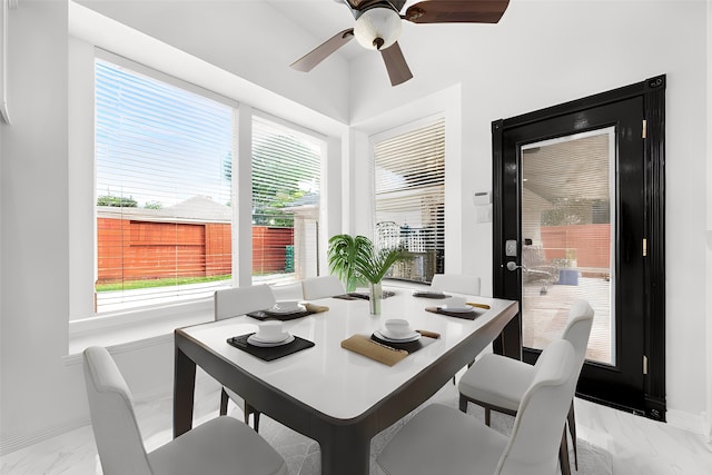 dining room featuring ceiling fan