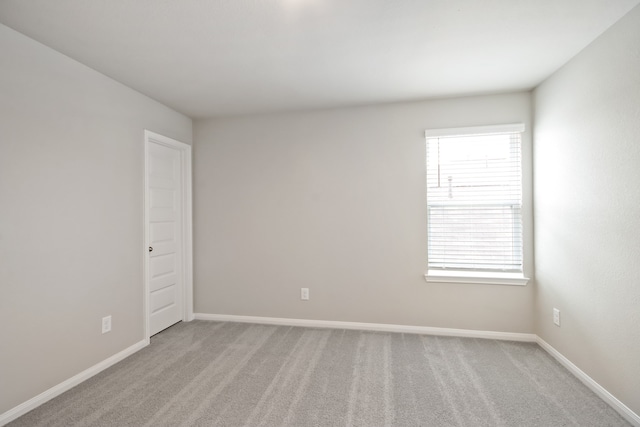 empty room with light colored carpet