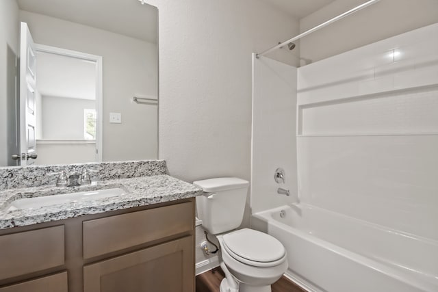 full bathroom featuring vanity, toilet, hardwood / wood-style flooring, and shower / washtub combination