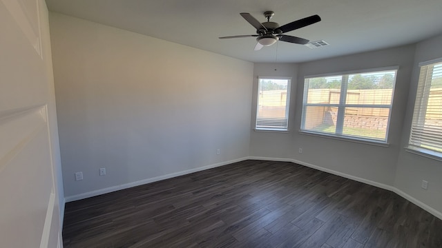 unfurnished room featuring ceiling fan and dark hardwood / wood-style floors