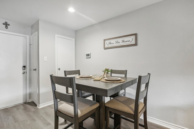 dining area with light wood-type flooring