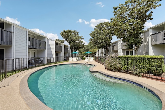 view of swimming pool featuring a patio area