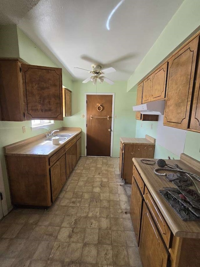 kitchen with ceiling fan and sink