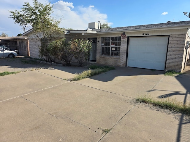 ranch-style house featuring a garage