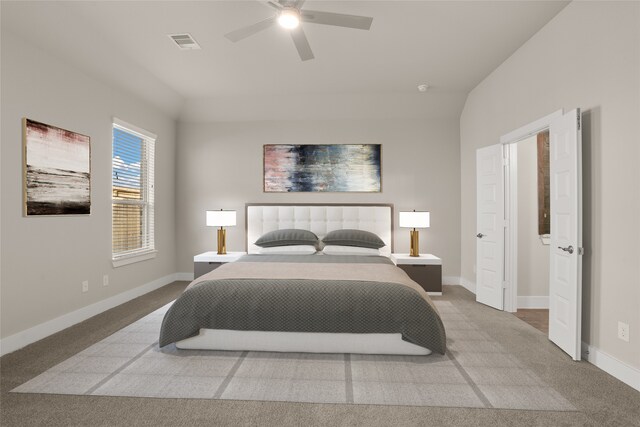 bedroom with ceiling fan, light carpet, and lofted ceiling