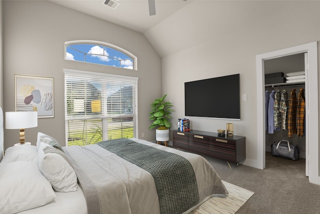 carpeted bedroom featuring a closet, vaulted ceiling, and ceiling fan