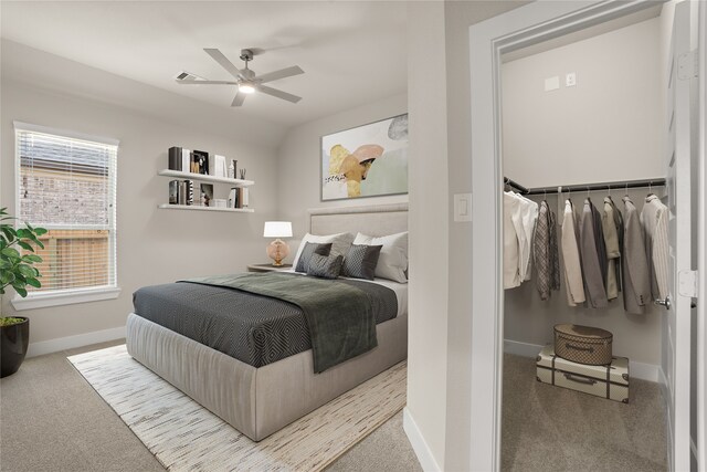 bedroom featuring vaulted ceiling, ceiling fan, and carpet floors