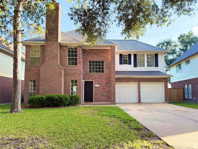 view of front of house featuring a front yard and a garage