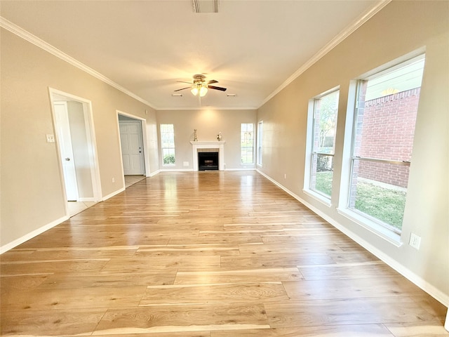 unfurnished living room with light hardwood / wood-style floors, ceiling fan, and crown molding