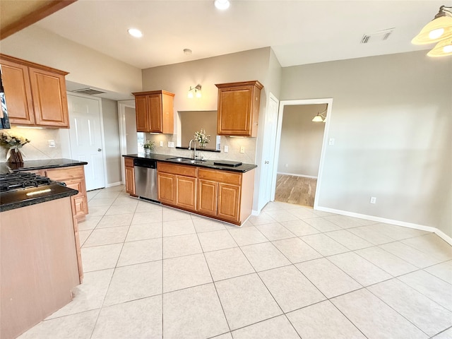 kitchen featuring dishwasher, light tile patterned flooring, and sink