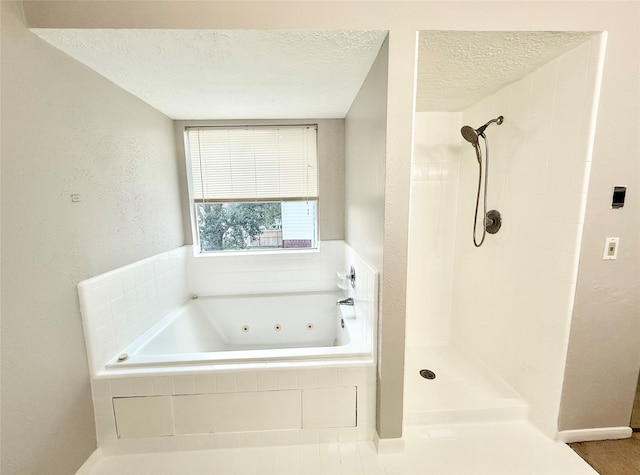 bathroom with a textured ceiling and plus walk in shower