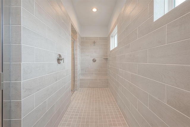 bathroom with tiled shower