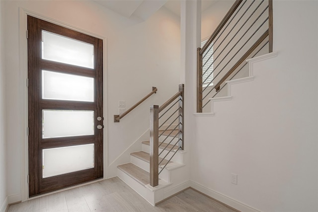 entryway with plenty of natural light and light hardwood / wood-style flooring