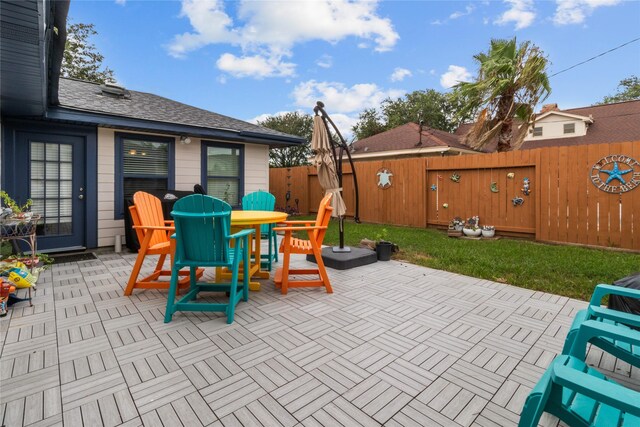 2602 Gerol Ct, Galveston, TX 77551 - view of patio / terrace with a fenced backyard and outdoor dining area