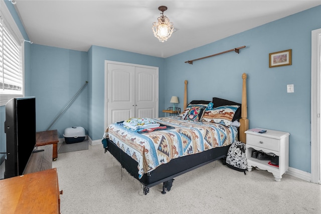 bedroom featuring a closet and baseboards