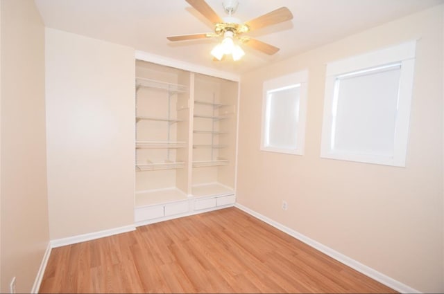 unfurnished room featuring ceiling fan and hardwood / wood-style floors