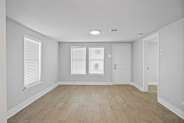 unfurnished room featuring light hardwood / wood-style flooring