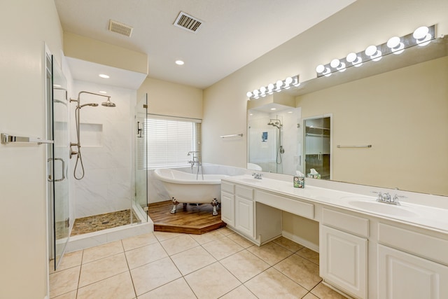 bathroom with vanity, tile patterned floors, and separate shower and tub