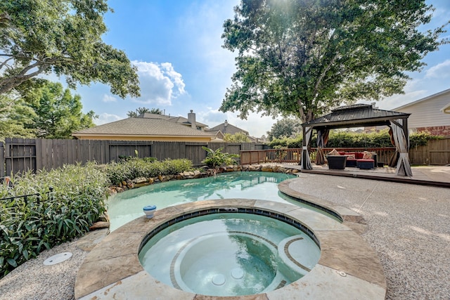 view of pool with a gazebo, an outdoor hangout area, a patio area, and an in ground hot tub